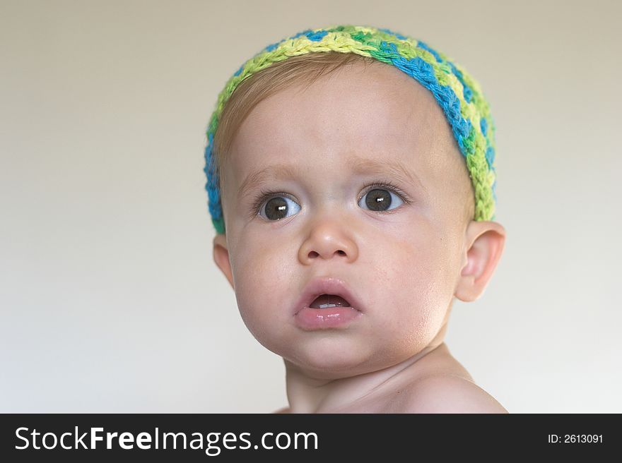 Image of beautiful toddler with a serious look on his face