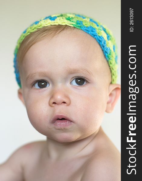 Image of beautiful toddler wearing a crochet cap