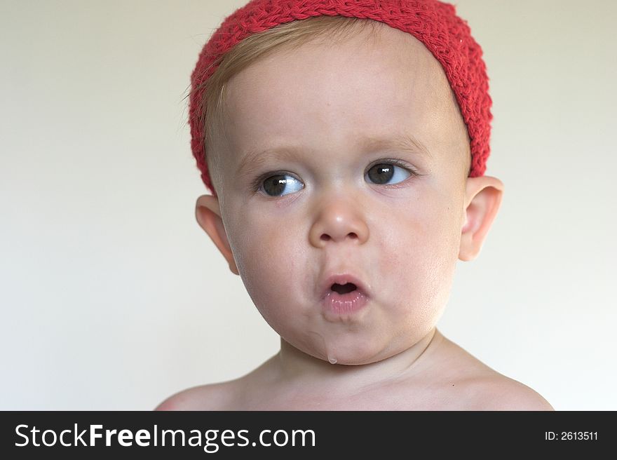 Image of beautiful toddler wearing a crochet cap