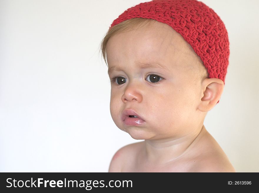 Image of beautiful toddler wearing a crochet cap