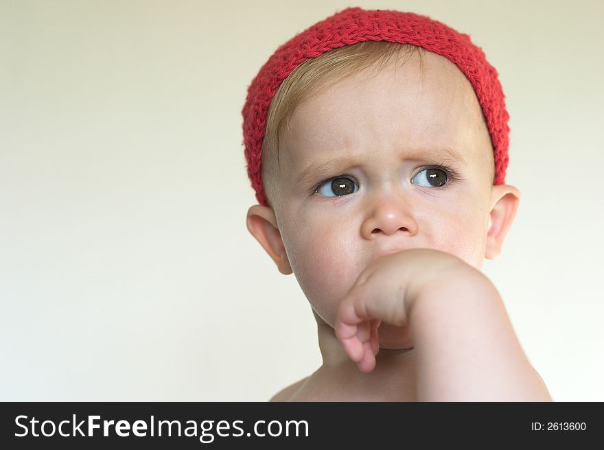 Image of beautiful toddler wearing a crochet cap