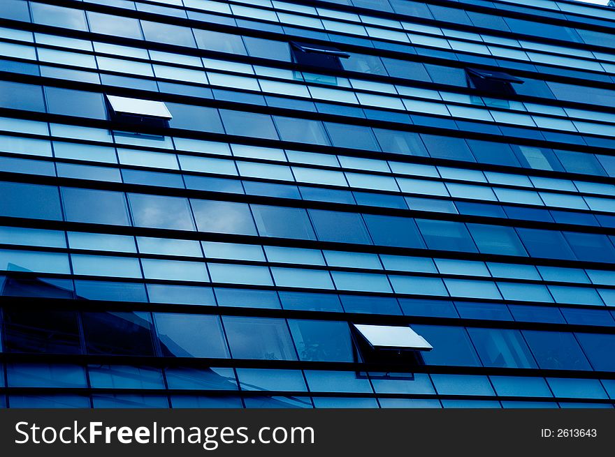 Windows of a modern building (blue tone). Windows of a modern building (blue tone)