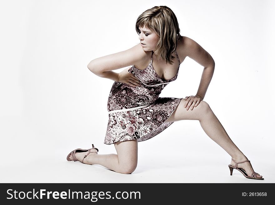 A young caucasian woman portrait taken in the studio on a white background. A young caucasian woman portrait taken in the studio on a white background