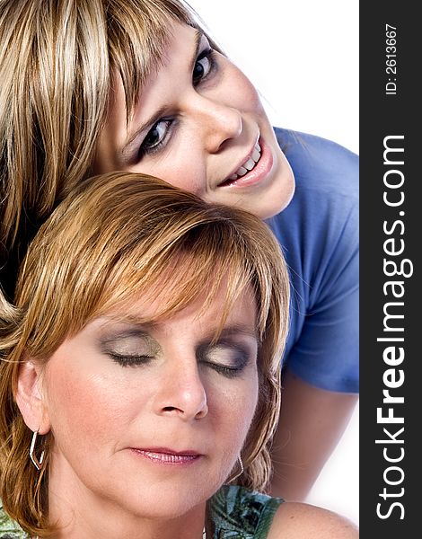 A portrait taken from mother and daughter taken on a white background. A portrait taken from mother and daughter taken on a white background