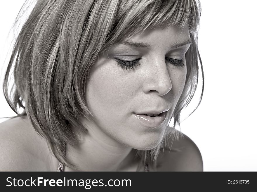 A young caucasian woman portrait taken in the studio on a white background. A young caucasian woman portrait taken in the studio on a white background