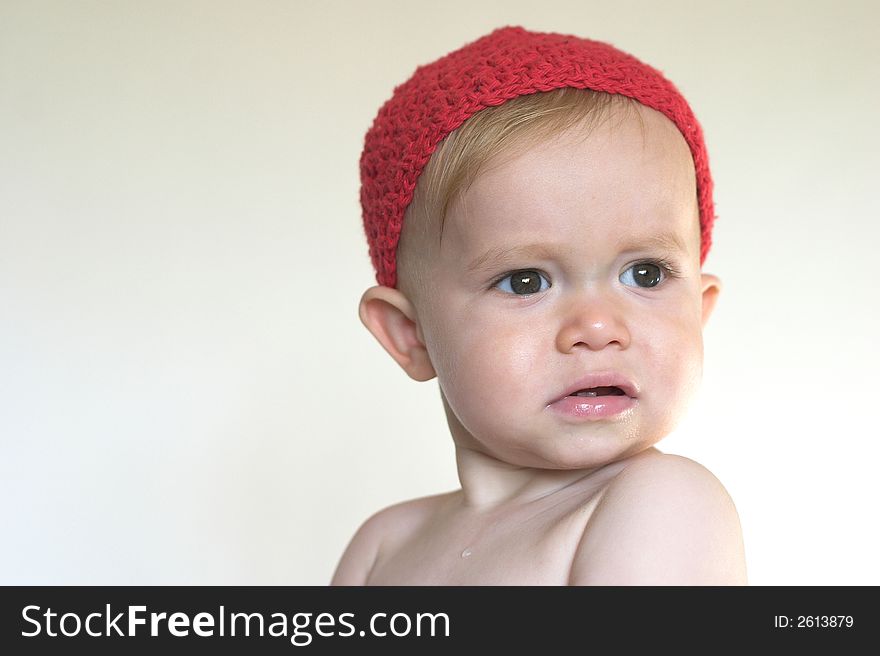 Image of beautiful toddler wearing a crochet cap