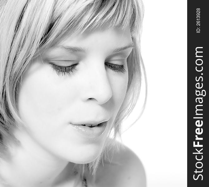 A young caucasian woman portrait taken in the studio on a white background. A young caucasian woman portrait taken in the studio on a white background