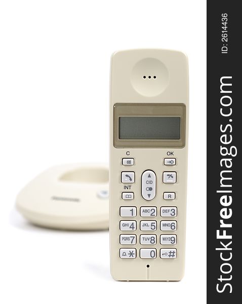 Single cream colored telephone isolated over white background. Focus on tube. Single cream colored telephone isolated over white background. Focus on tube.