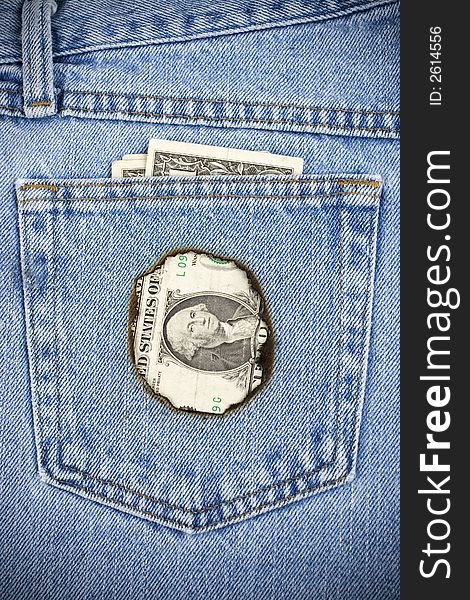 Closeup image of money burning a hole in your pocket.