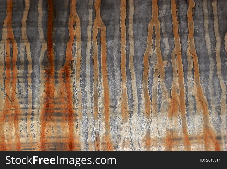 Stripes of rust on a metallic surface. Stripes of rust on a metallic surface