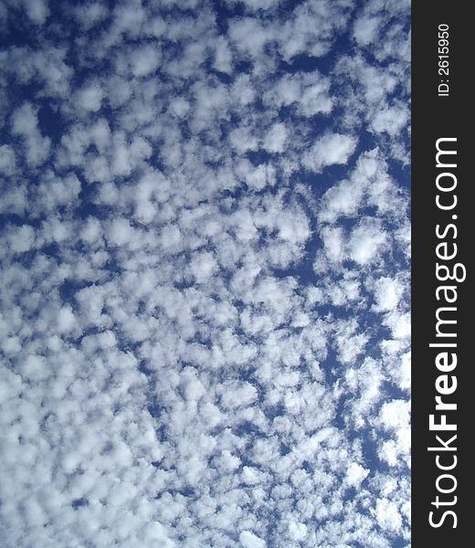 Abstract image of the broken clouds against the blue sky. Abstract image of the broken clouds against the blue sky.