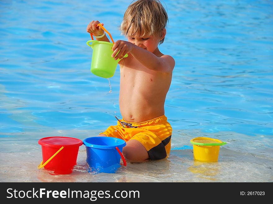 Boy playing in pool