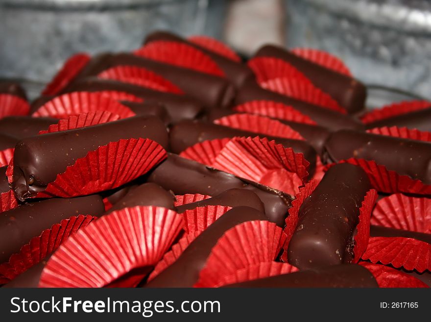 A pile of Cayenne chocolates in red wrappers