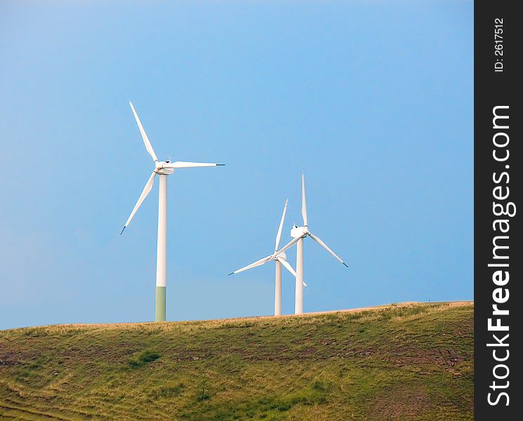 Wind generators of electric energy on a green hill