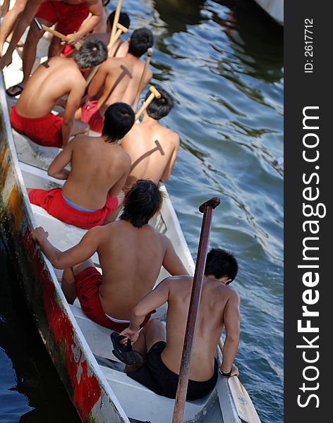 People practicing rowing at the seaside