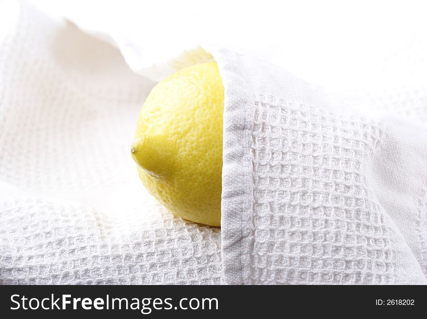 Lemon covered by white cloth