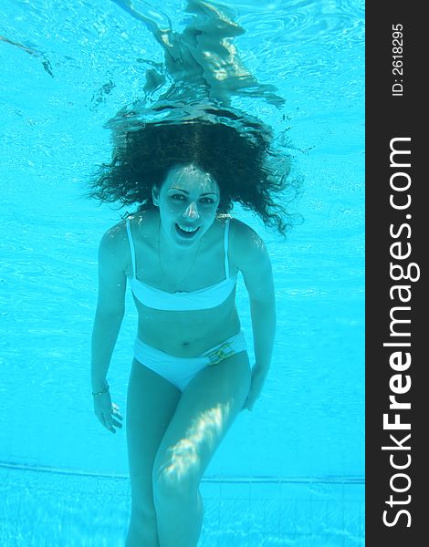 Woman underwater in the swimming pool