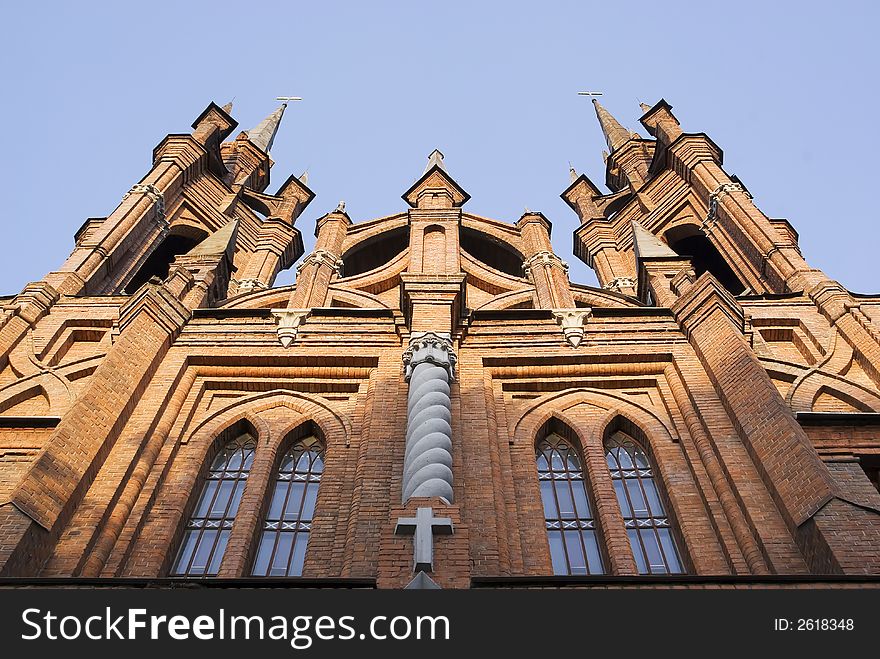 Catholic Church of red brick. The Gothic style