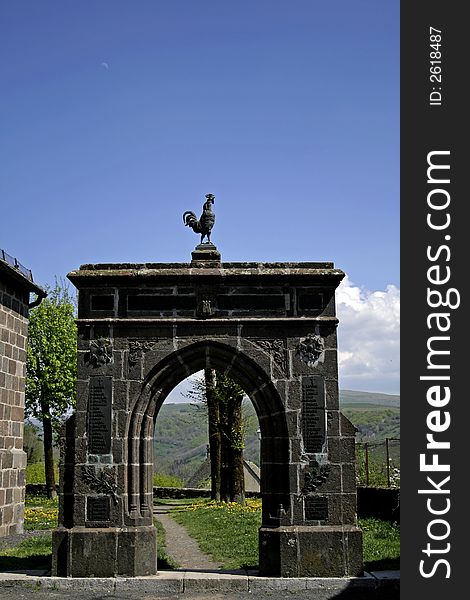 Cock standing  stones archway