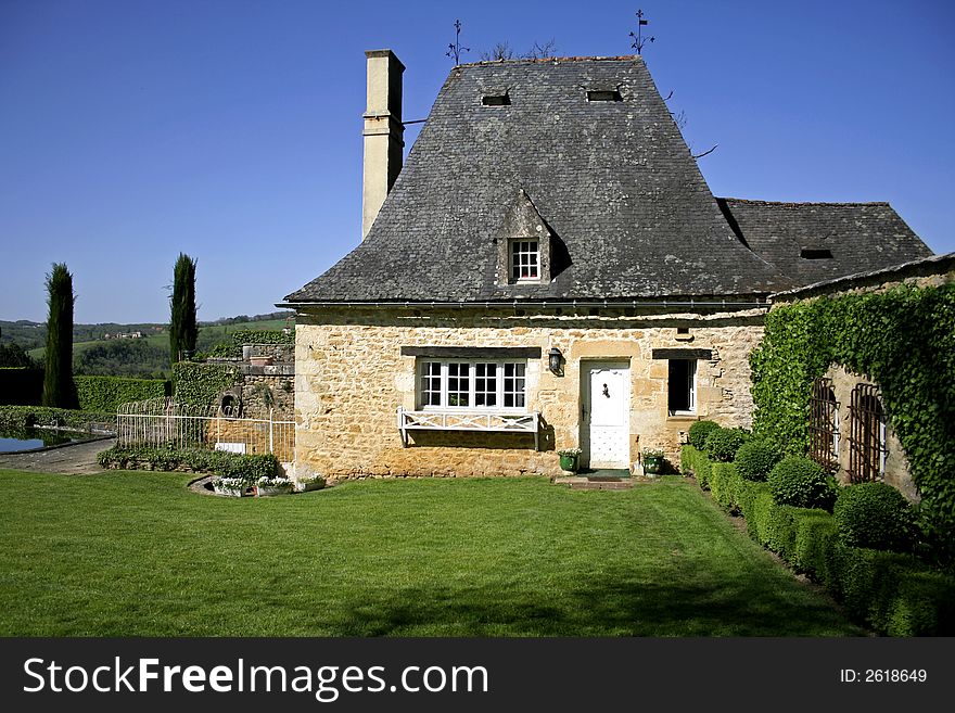 Old renovated stone house and garden