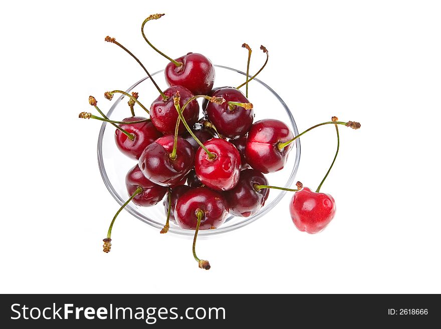 Cooled sweet cherries in drops of waters shined from below