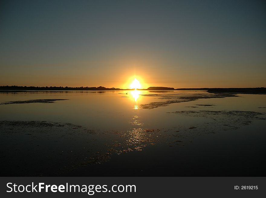 Sunrise reflection in the Lake Illawarra NSW Australia