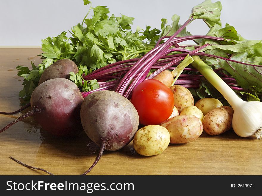 Fresh vegetables: garlic, carrot, parsley, tomato, potato, red beet