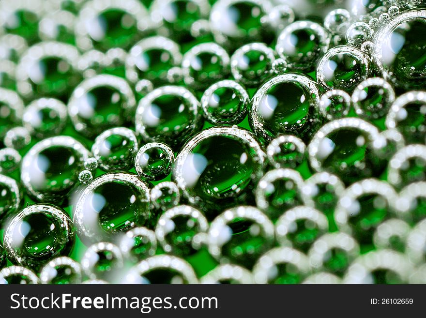 Close up shot of soap foam mixed with green dye. Close up shot of soap foam mixed with green dye