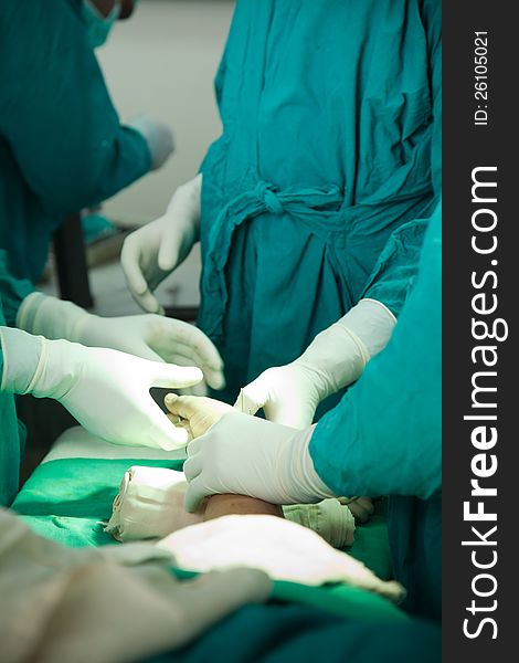 Close up of nurse hands during surgery in operation room. Close up of nurse hands during surgery in operation room