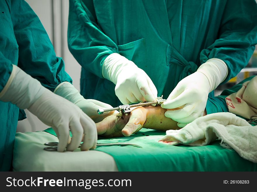 Close up of nurse hands during surgery in operation room. Close up of nurse hands during surgery in operation room