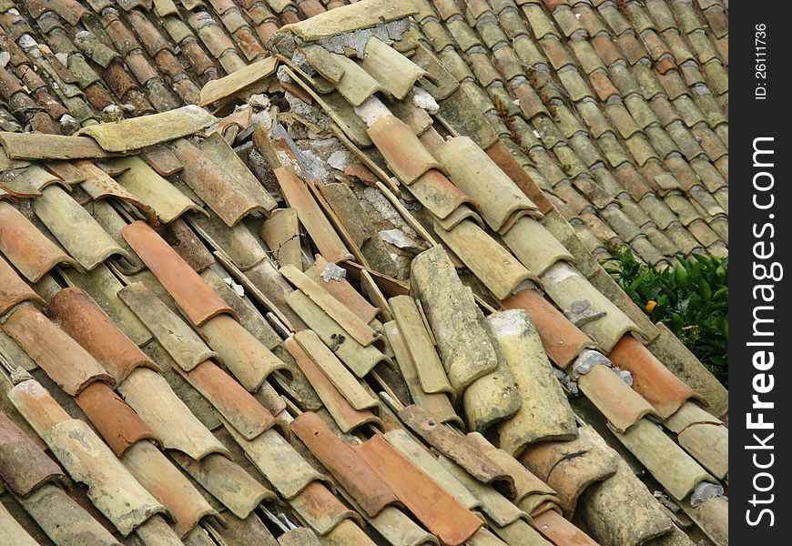 Remains Of A Roof With Broken Tiles