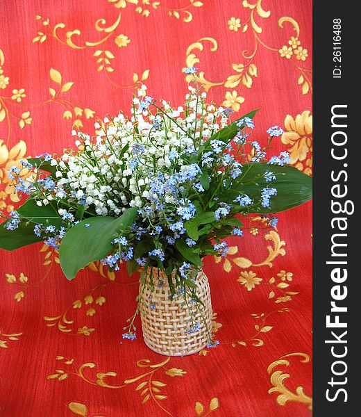 Bouquet of lilies of the valley and blue flowers