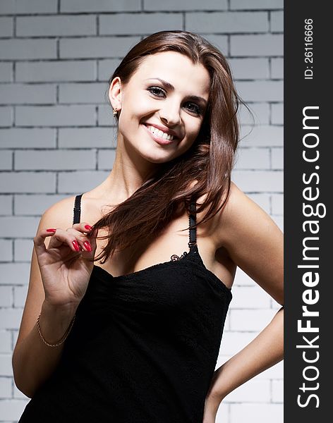 Woman In Front Of Brick Wall