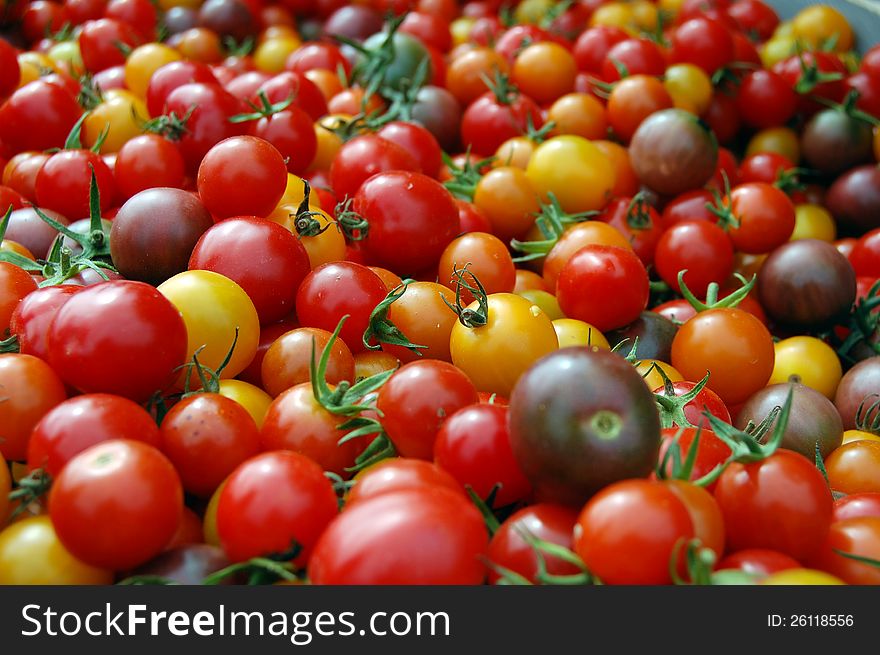 A bunch of different colored cherry tomatoes. A bunch of different colored cherry tomatoes.