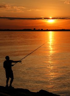 Fishing At Sunset Stock Photo Fishing At Sunset Stock Photo