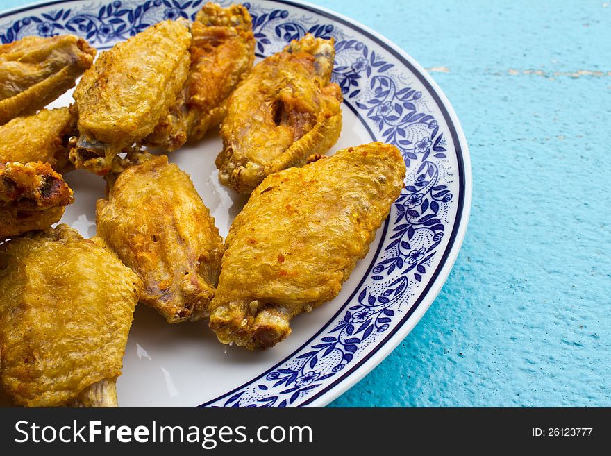 Fried chicken wings in the dish