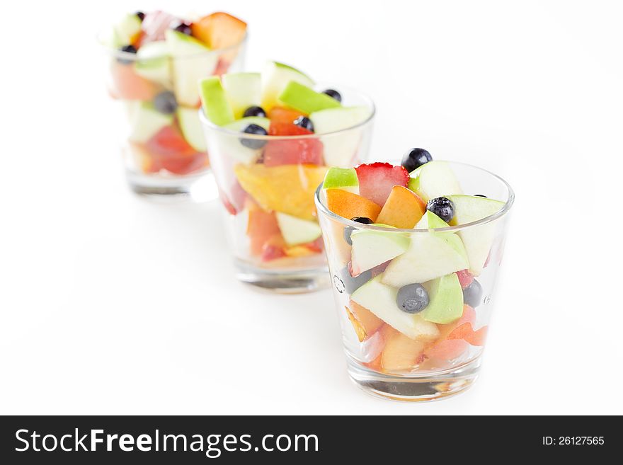 Close up photograph of three glasses of fresh fruit salad. Close up photograph of three glasses of fresh fruit salad