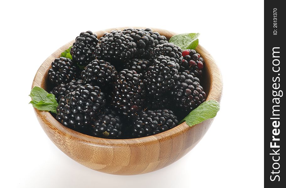 Perfect Ripe Blackberries in Wooden Bowl  on white background
