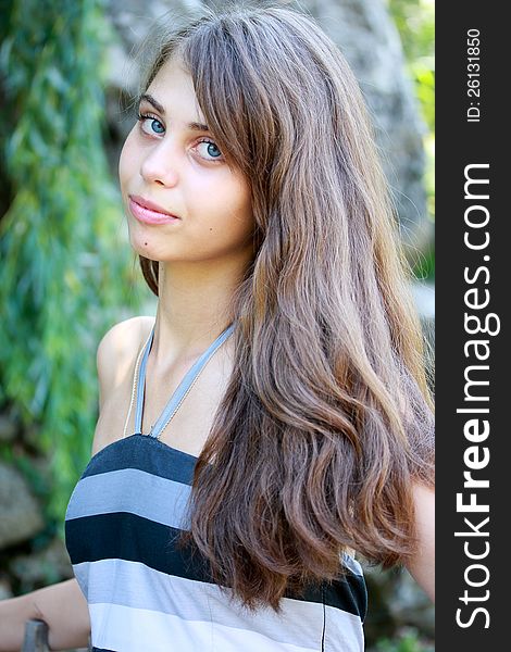 Portrait of beautiful girl with long hair, outdoor