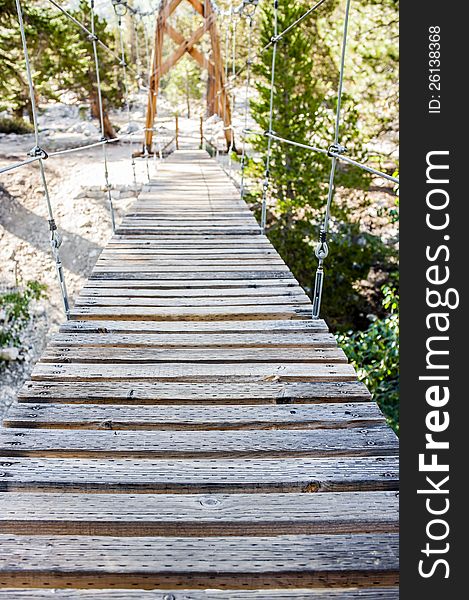 First person view of a swinging footbridge in Kings Canyon National Park. First person view of a swinging footbridge in Kings Canyon National Park.