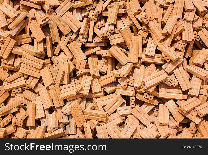 Stack of raw bricks texture background