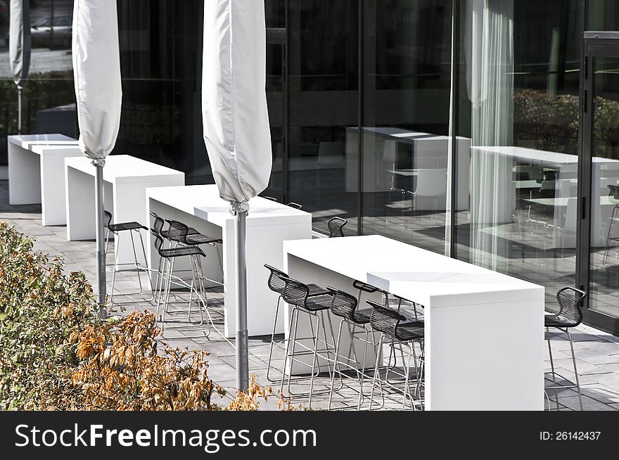 Modern architecture - fashionable outdoor cafe or restaurant tables in Germany. Modern architecture - fashionable outdoor cafe or restaurant tables in Germany