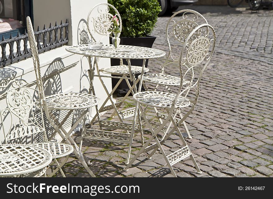 Old town outdoor cafe with vintage chairs. Old town outdoor cafe with vintage chairs