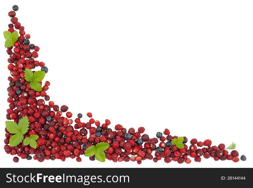 Delicious wild strawberries and blueberries with green leaves isolated on white background