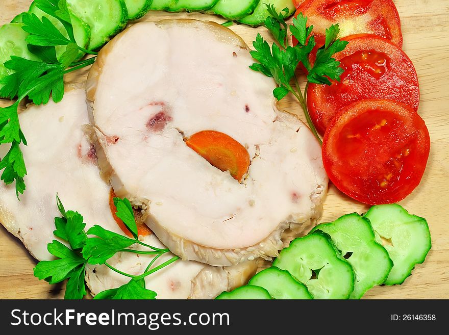 Two pieces of chicken ham with vegetables