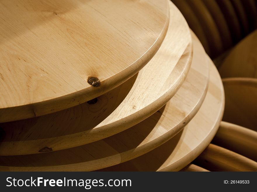 Round wood cutting boards stacked upon each other. Round wood cutting boards stacked upon each other