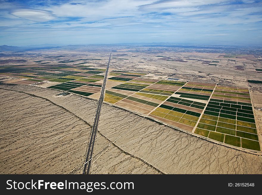 High level aerial view of farmland in the desert between Phoenix and Casa Grande, Arizona. High level aerial view of farmland in the desert between Phoenix and Casa Grande, Arizona