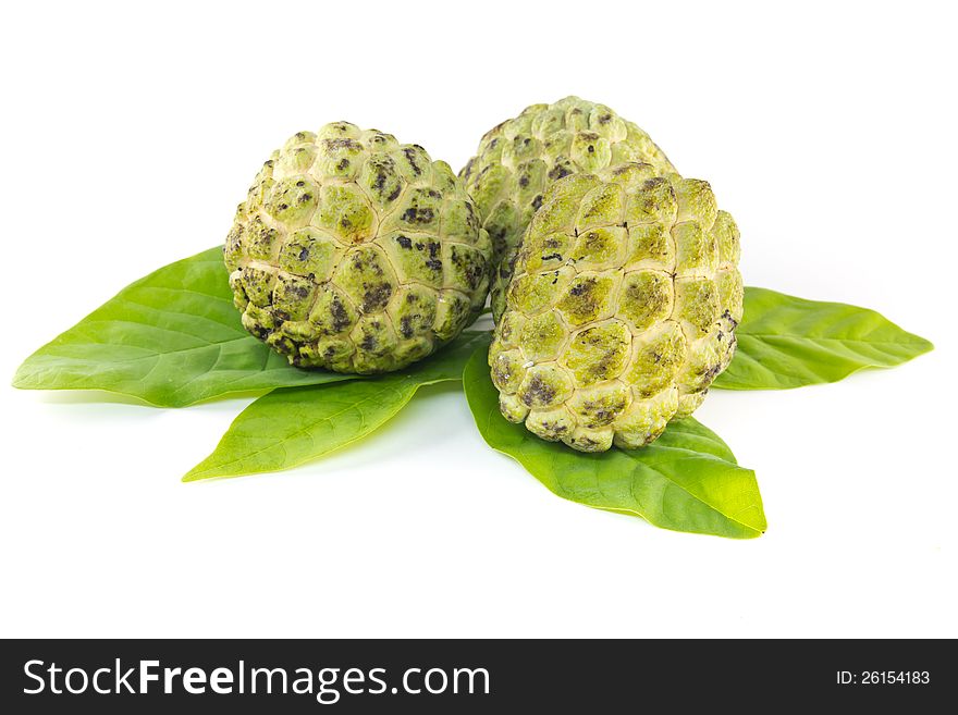 Custard apple  and leaves on white background