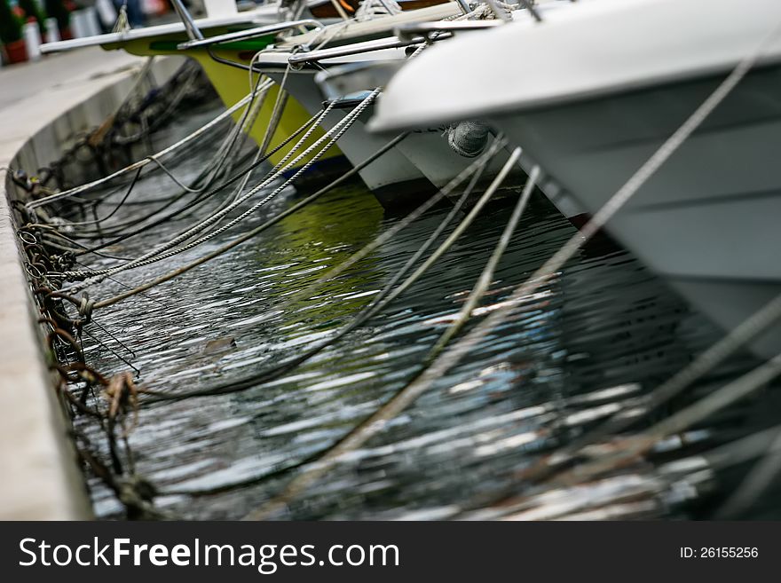 Boats hitched to a sement wall in Croatia