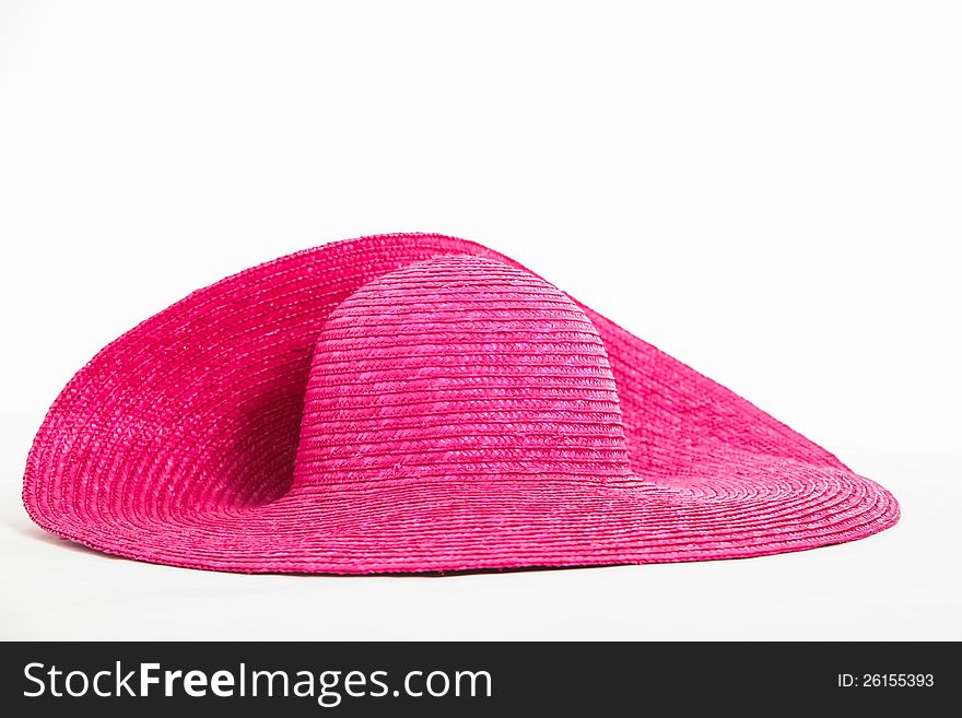 Pink hat being photographed in the studio.